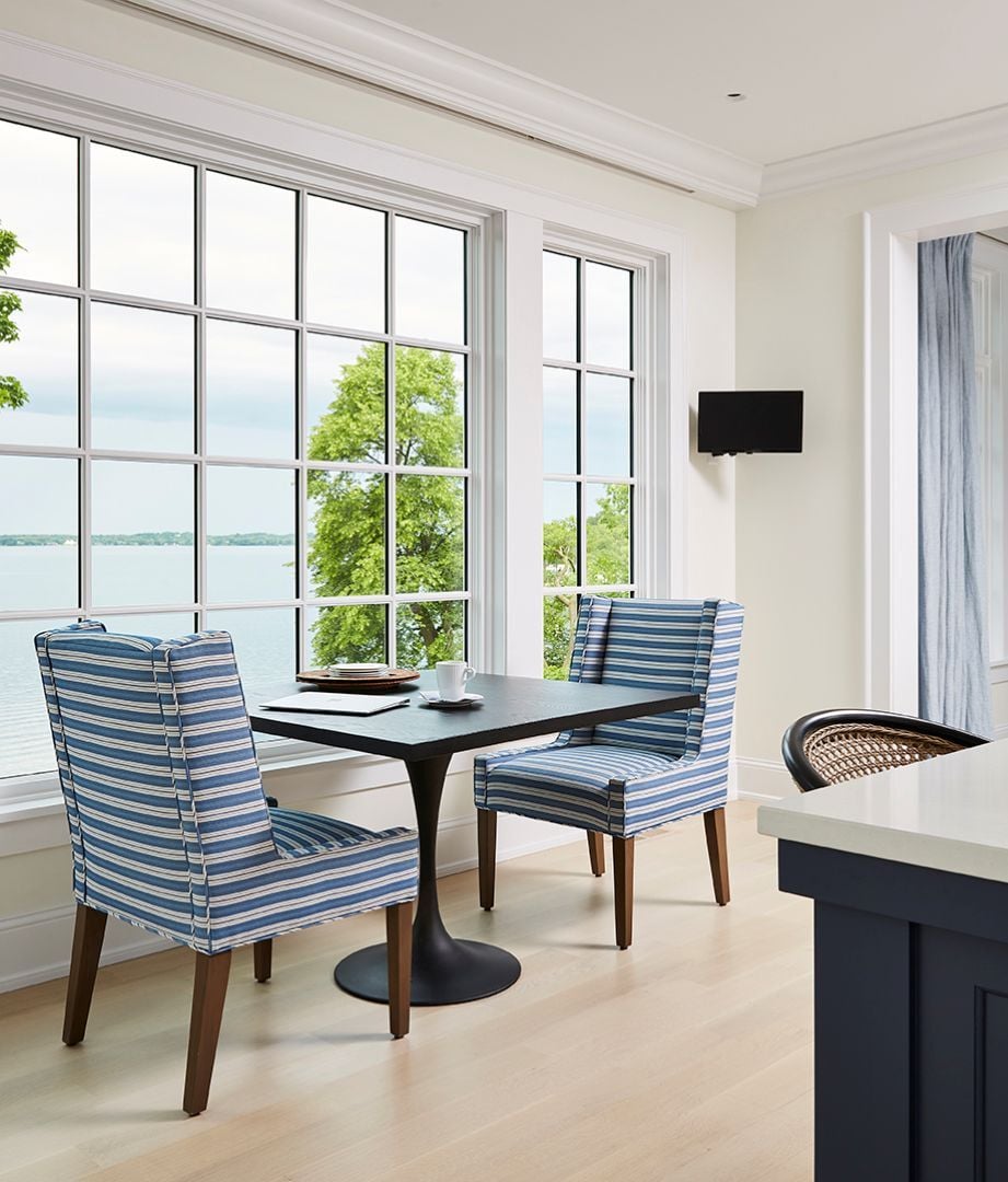 Modern striped chairs and table looking out over lake in remodel by MA Peterson Modern striped chairs and table looking out over lake in remodel by MA Peterson