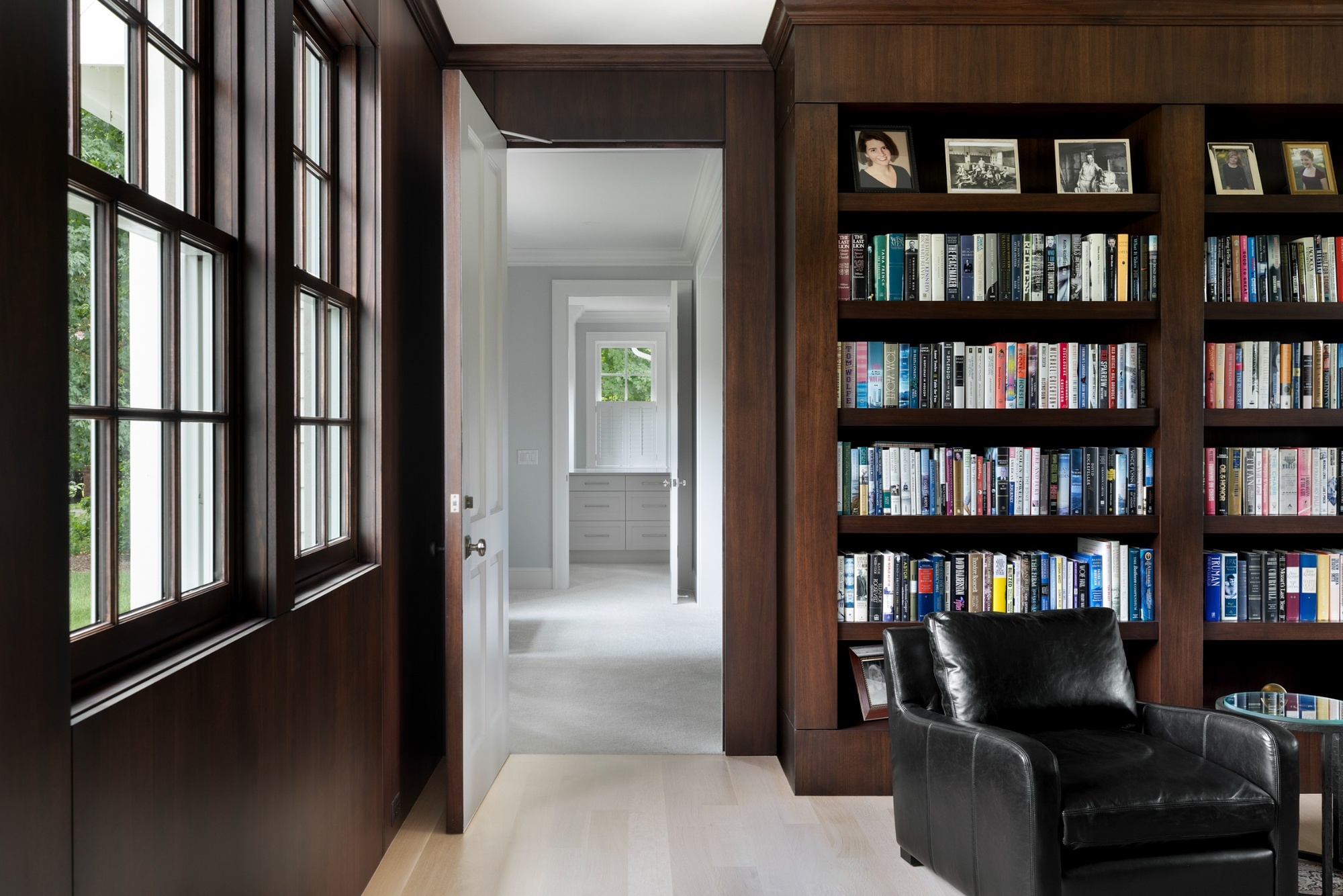custom home library doorway with dark wood built in bookshelves in wayzata mn