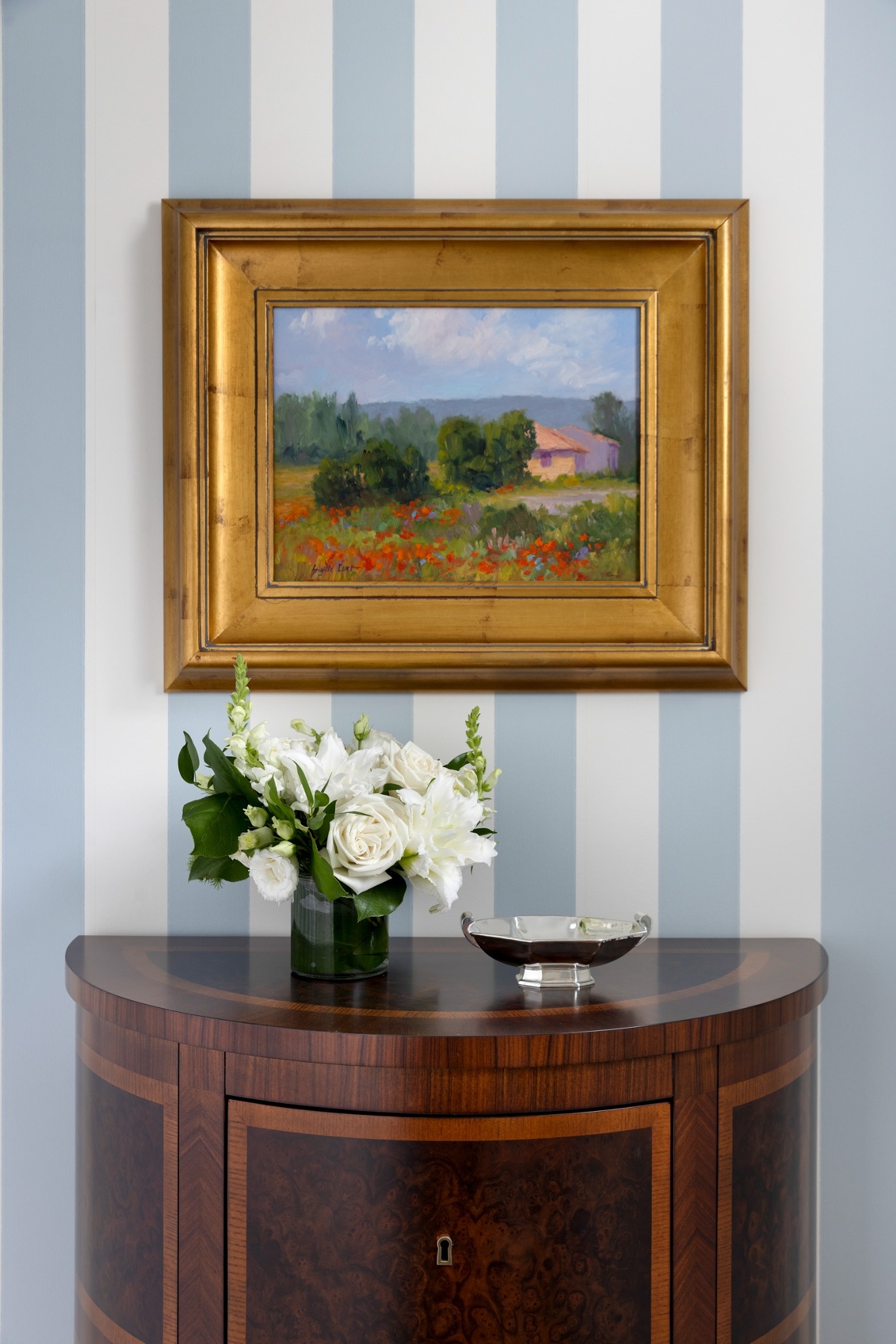 custom home powder room decor with striped walls and wood console in wayzata mn