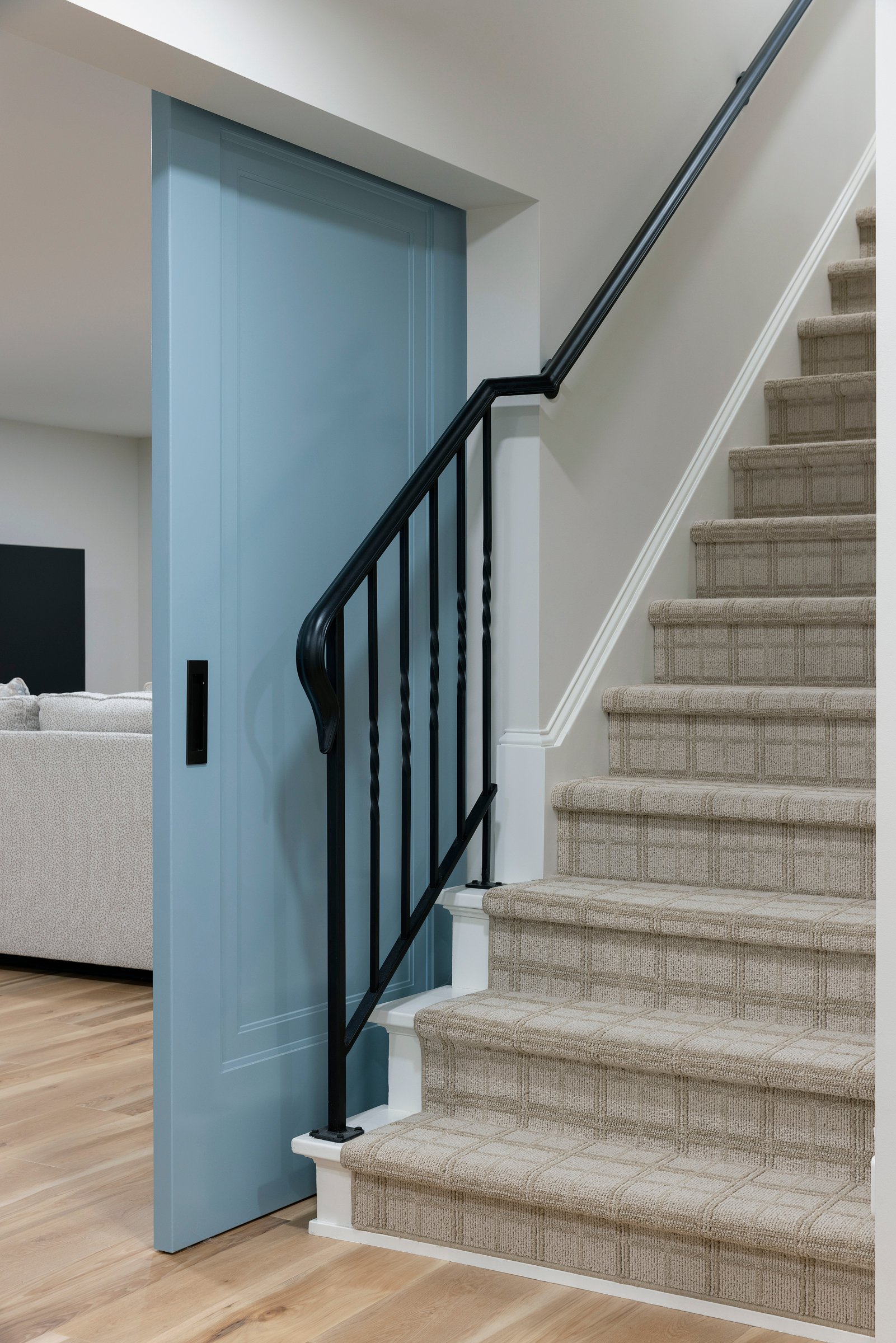 Staircase detail showcasing custom railing and thoughtful architectural design