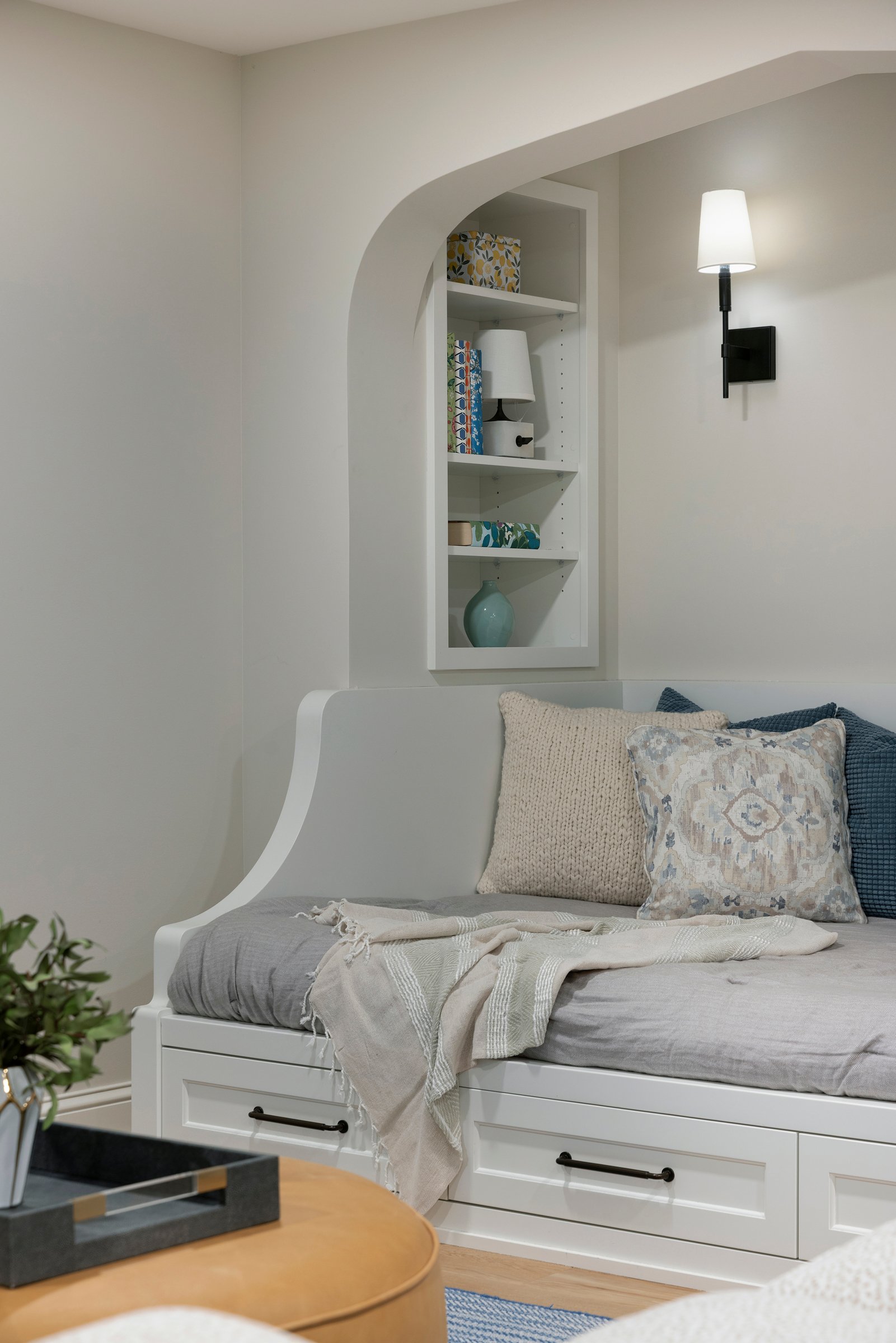 Custom daybed with tailored upholstery and surrounding millwork