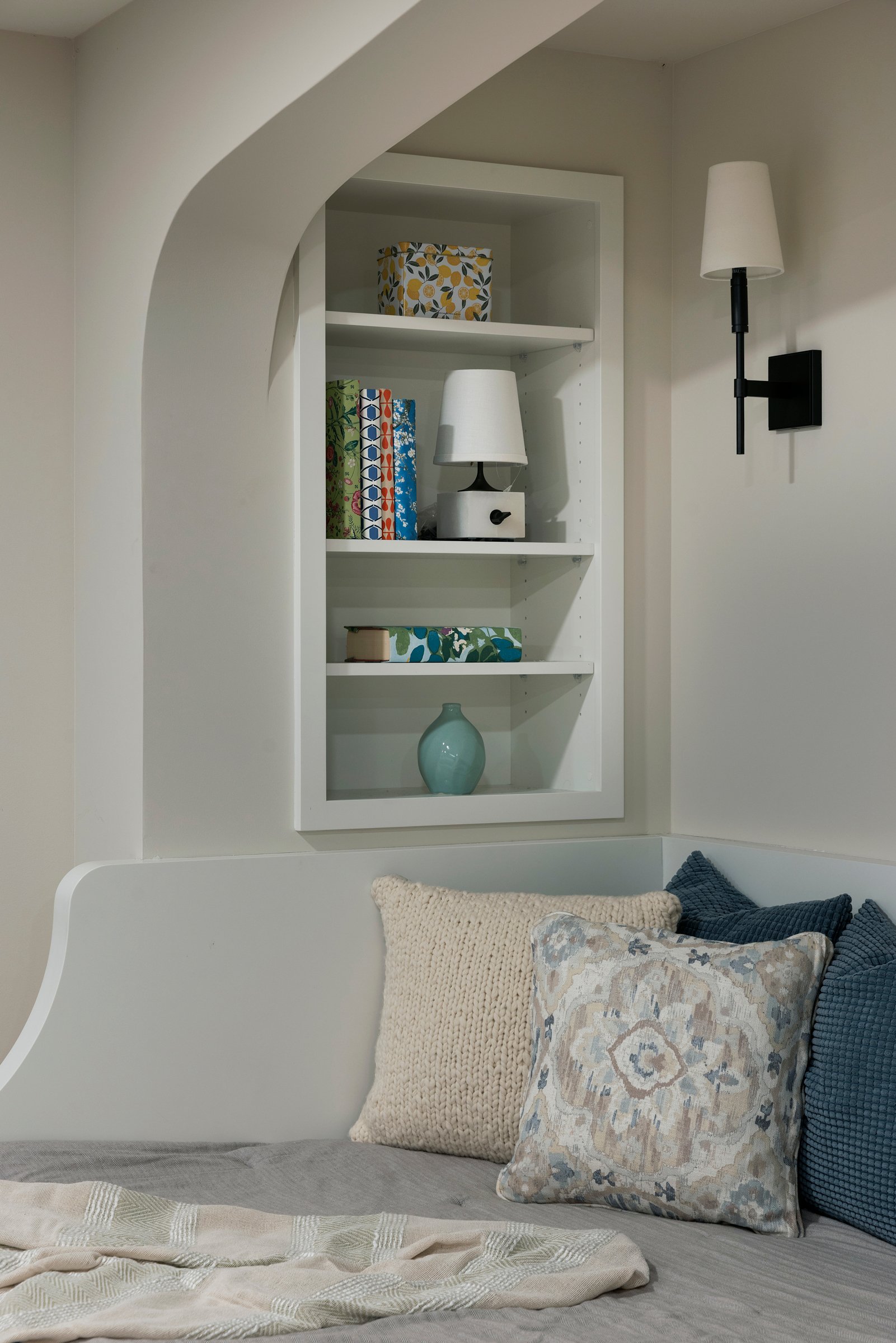 Custom daybed with tailored upholstery and surrounding millwork