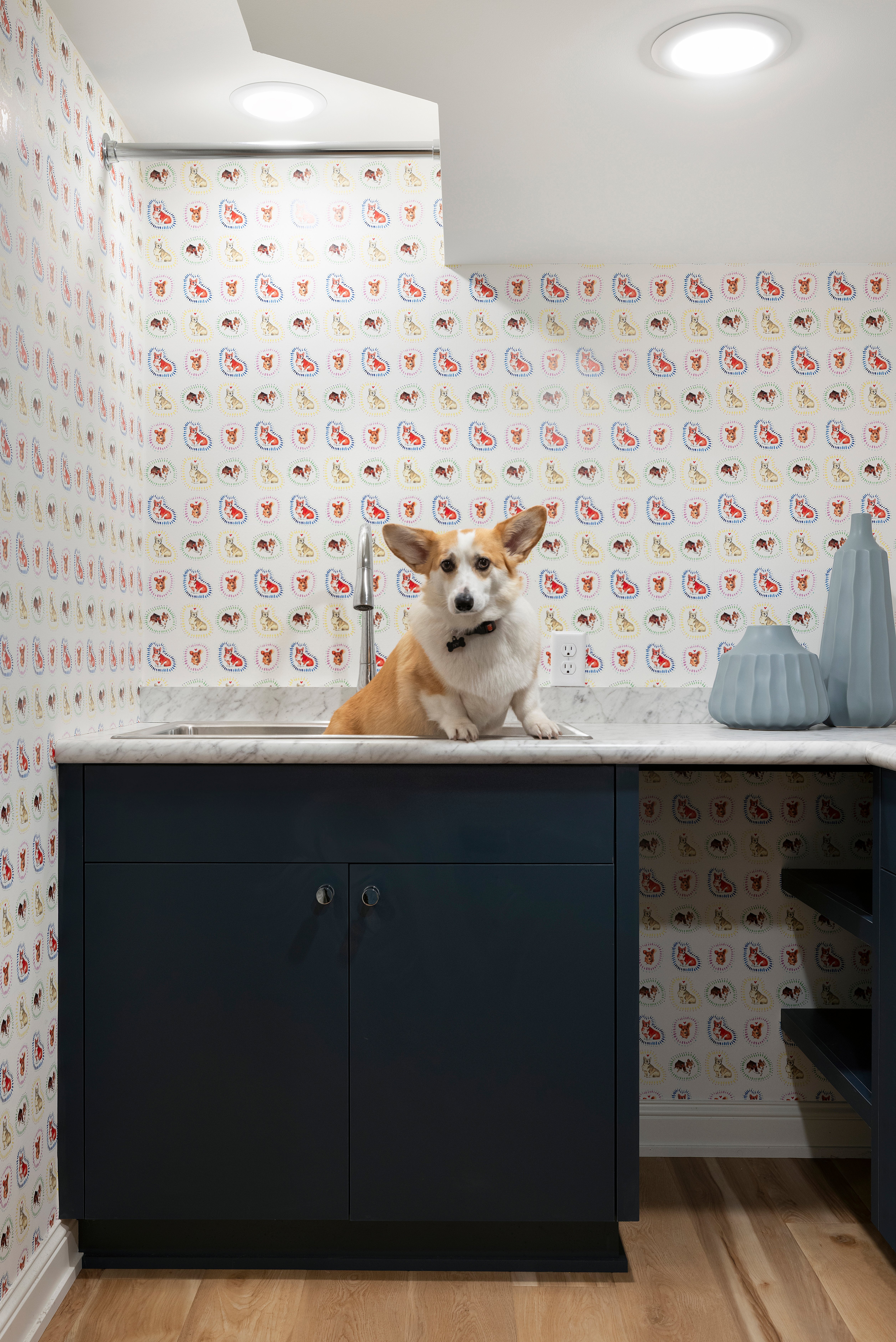 Custom laundry room with built-in cabinetry and functional countertop space