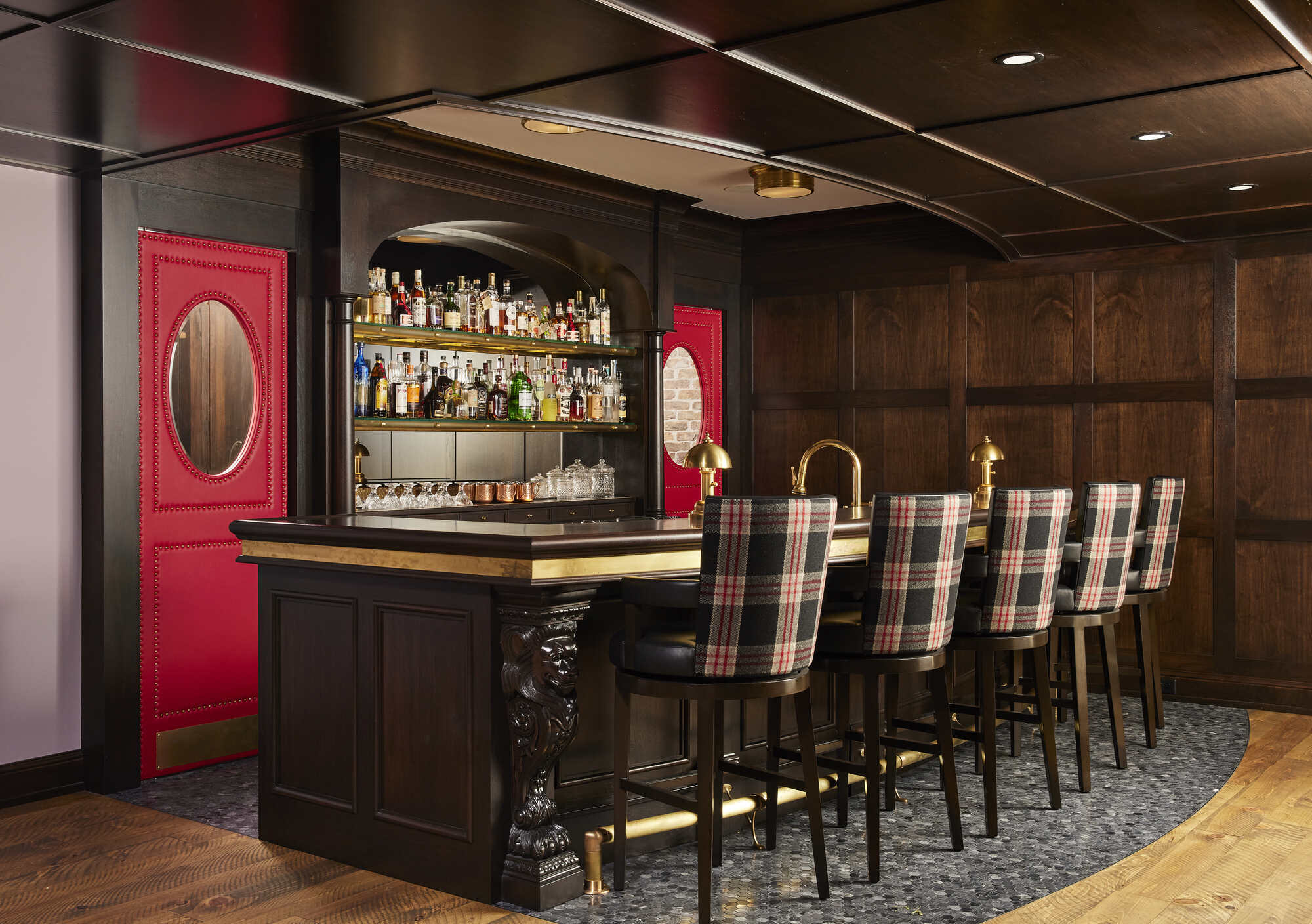 Elegant home bar with custom cabinetry and glassware by MA Peterson, Twin Cities