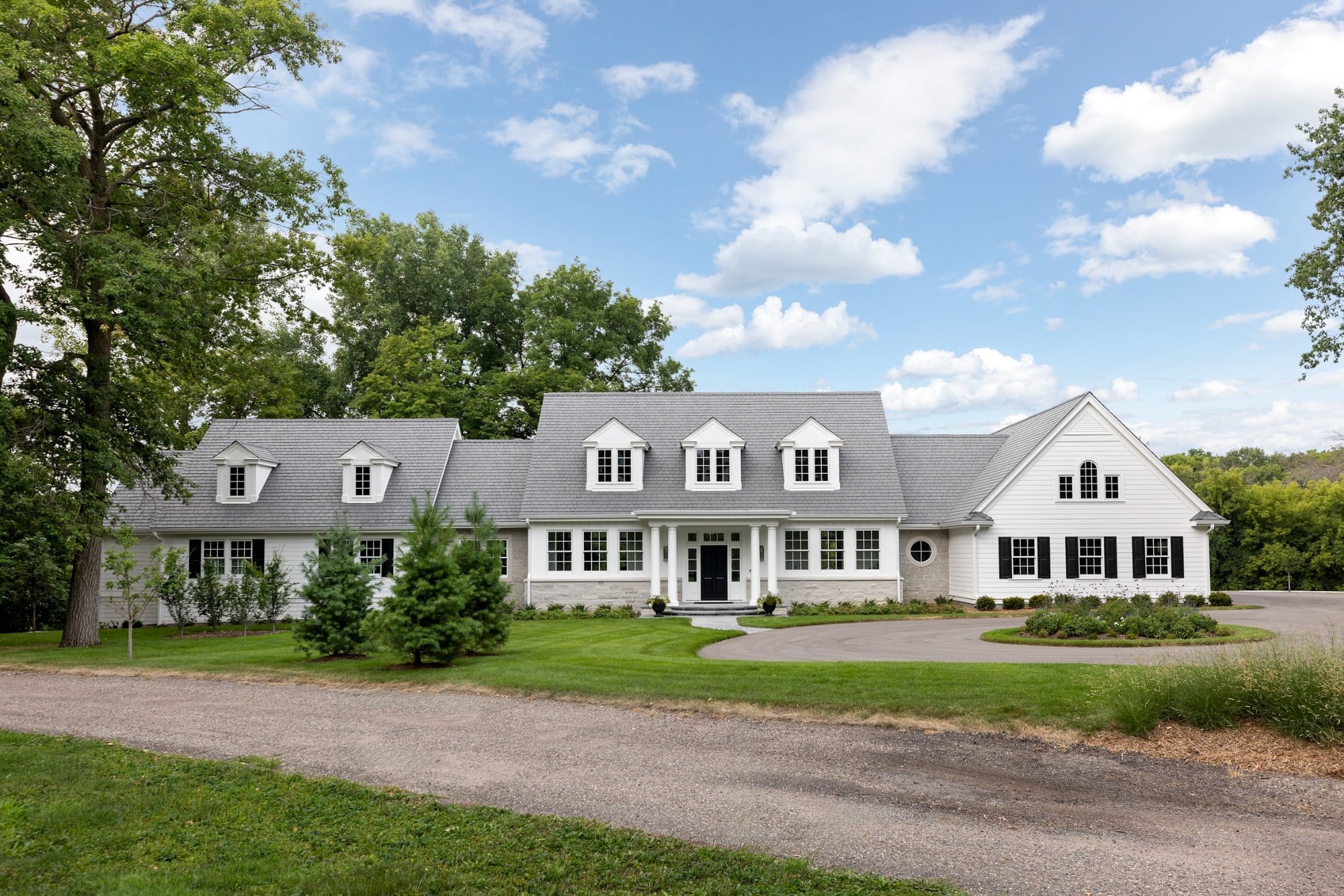 full front elevation with dormers and landscaped circular drive on custom home in wayzata mn full front elevation with dormers and landscaped circular drive on custom home in wayzata mn