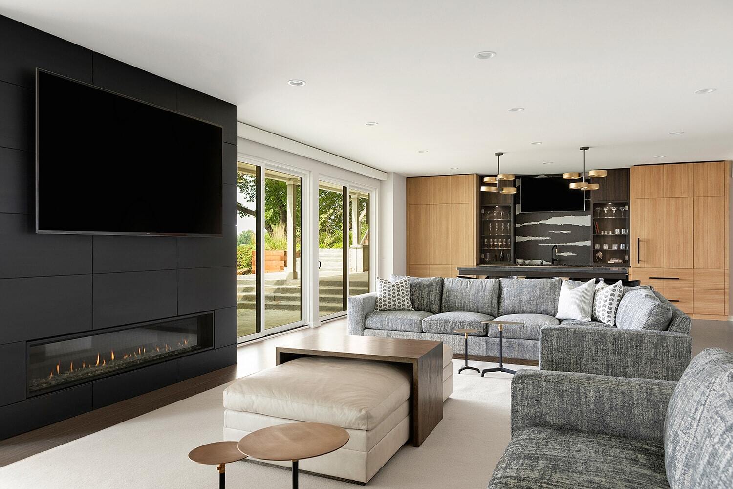 Contemporary living room with a large sectional sofa and modern decor, designed by MA Peterson in Twin Cities