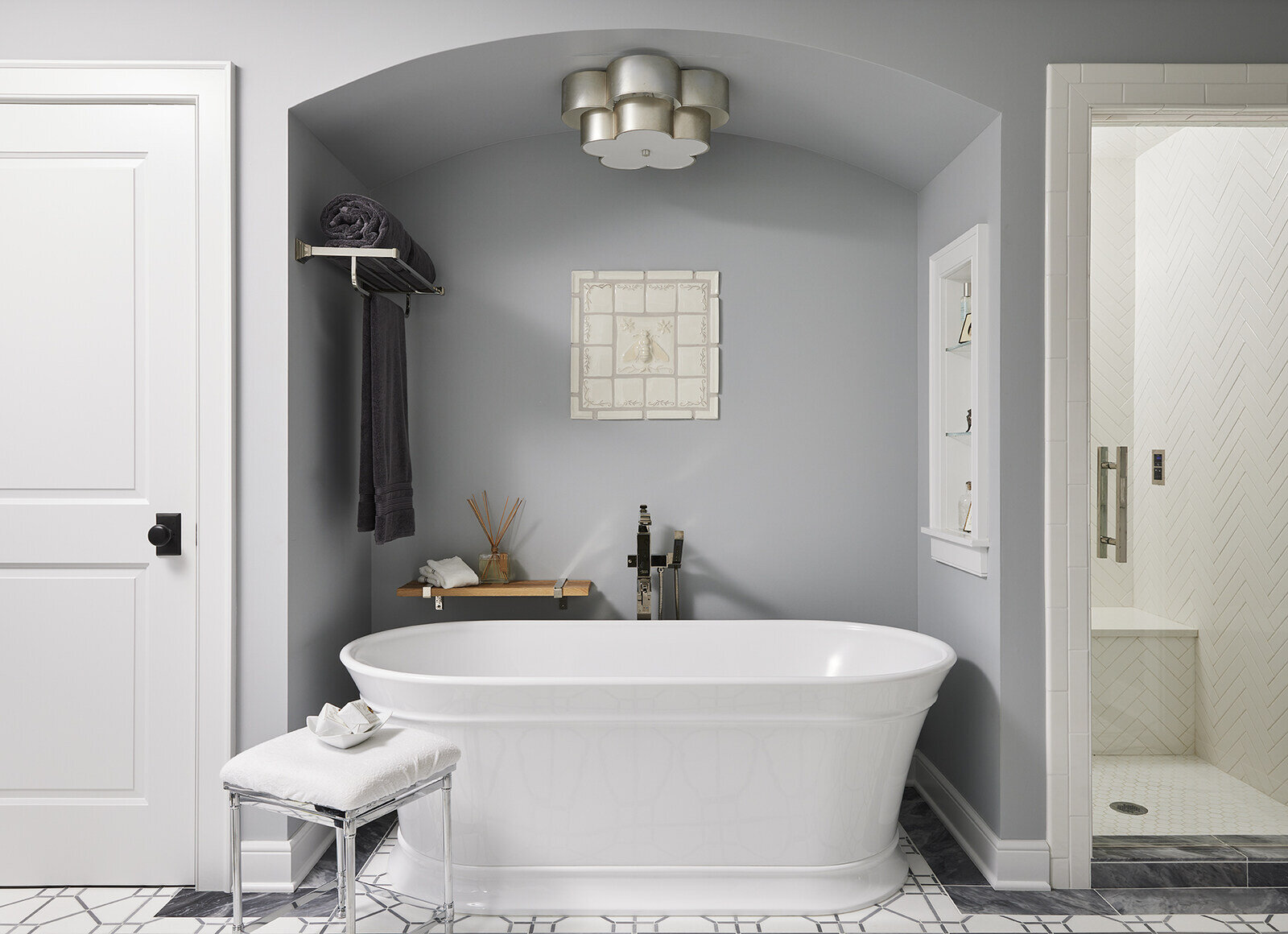 Elegant bathroom with freestanding tub and gray walls in a Twin Cities remodel by MA Peterson